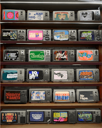 a collection of old tvs on a shelf